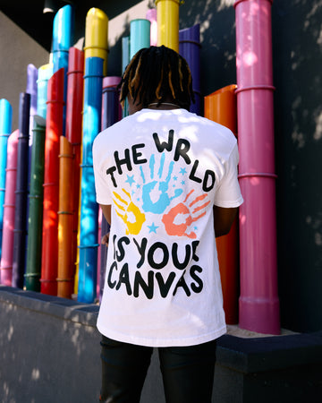 “The Wrld Is Your Canvas” Tee (White/Multicolor)